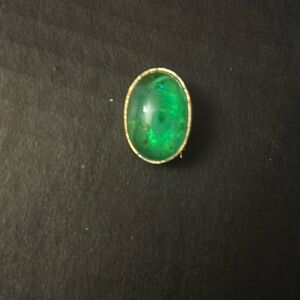Vintage green woman’s pin.